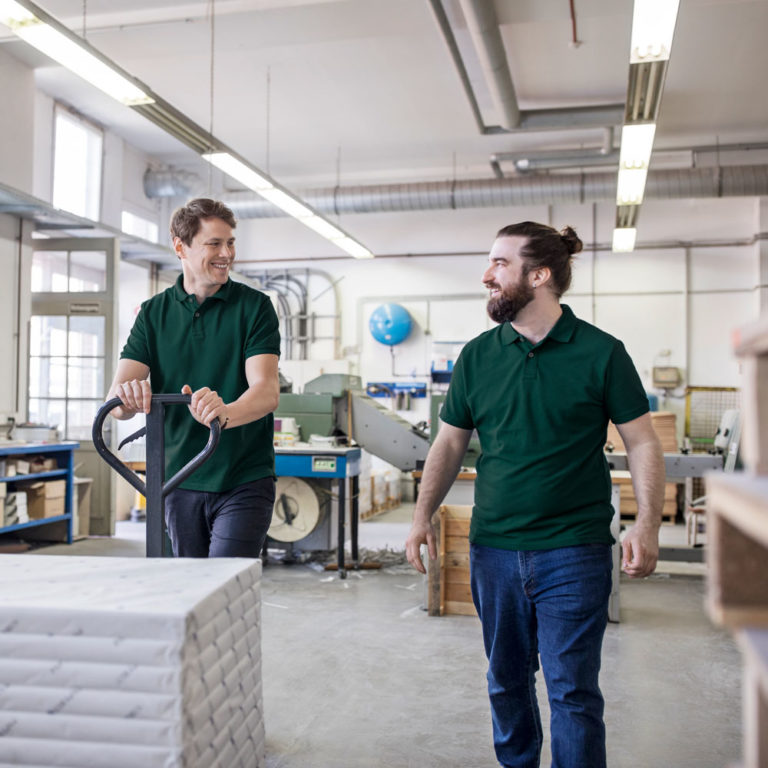 Hub Group workers providing paper logistics and moving products in warehouse