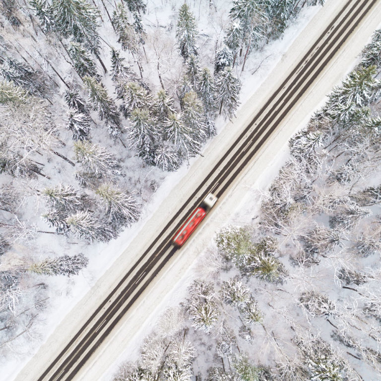 Carrier in motion driving through icy roads, providing emergency freight solutions and services