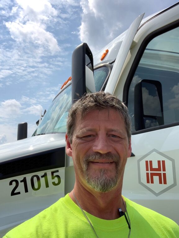 Hub Group employee in front of his truck